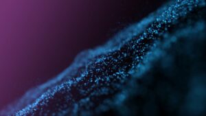 Wave of blue particles on a dark background