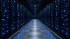 Data center aisle lined with blue-lit server racks
