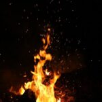 Flames rising in the dark