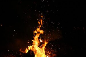 Flames rising in the dark