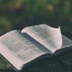 Open Bible on a dark surface