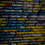Close-up of highlighted code on a monitor