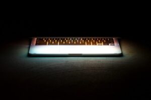 Keyboard lit from below in darkness