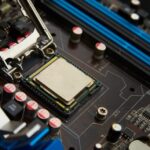 Motherboard with CPU socket and blue RAM slots
