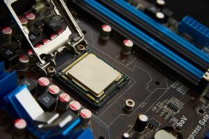 Motherboard with CPU socket and blue RAM slots