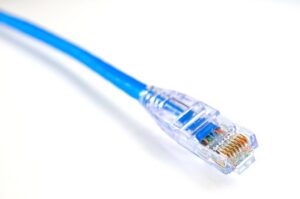 Blue Ethernet cable with connector on white