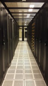 Narrow aisle between server racks